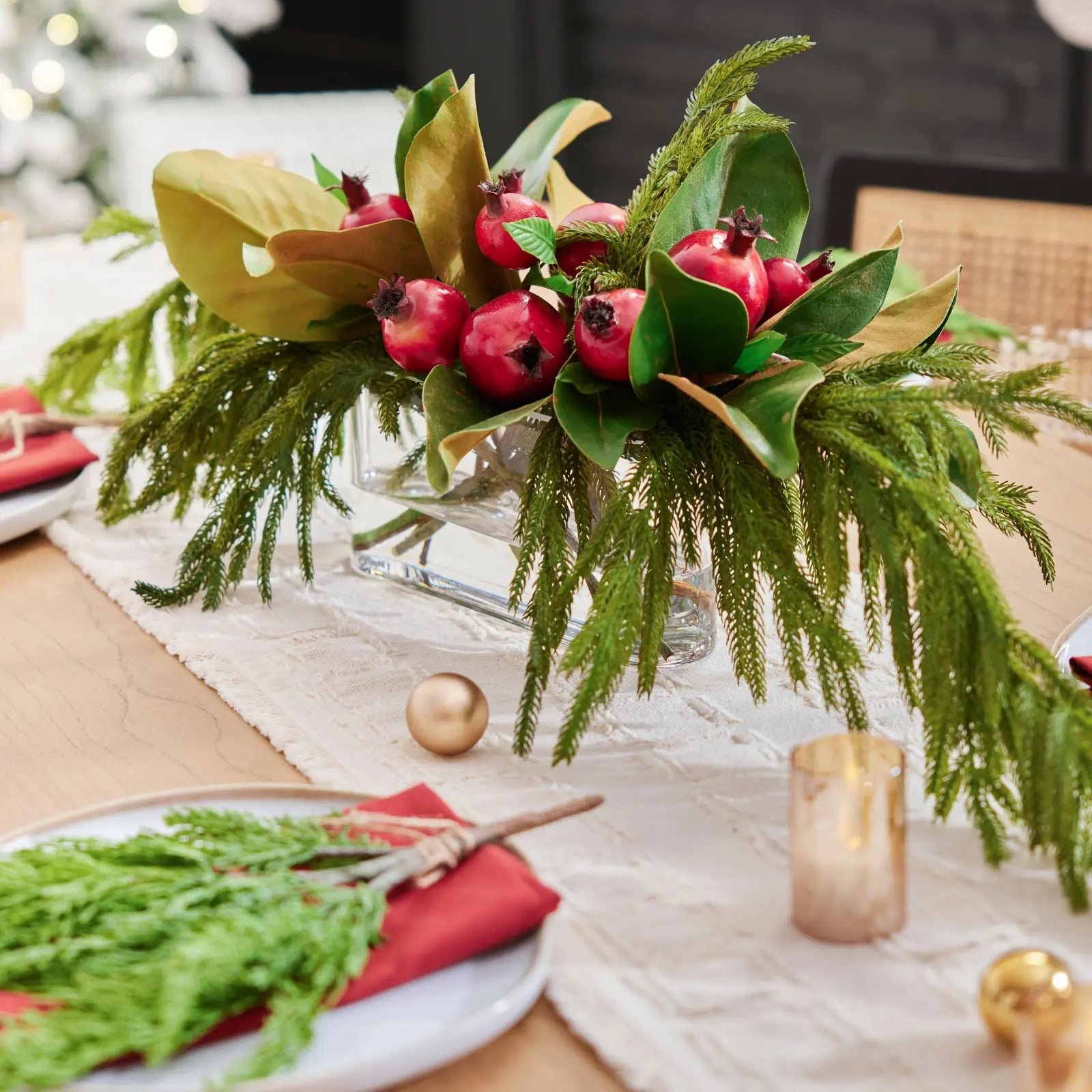 27649_DarbyCreekTrading_17034SQ Lifelike Red Pomegranate, Real Touch Magnolia Leaves, & Norfolk Pine Holiday Arrangement in Oval Vase Christmas Centerpiece - Image 1