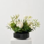 Jungle Elegance - Large White Protea Blooms, Wild Fern & Pittosporum Tropical everyday Modern Floral Arrangement in Rounded Black Glass Vase - Image 3