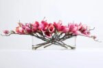 White or Fuchsia Magnolia Blooms Floral Centerpiece Water Illusion Arrangement in Oval Vase - Image 4