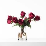 Real Touch Dark Red Burgundy Rose Buds In Teardrop Pyramid Glass Vase Water Illusion All Season Floral Arrangement