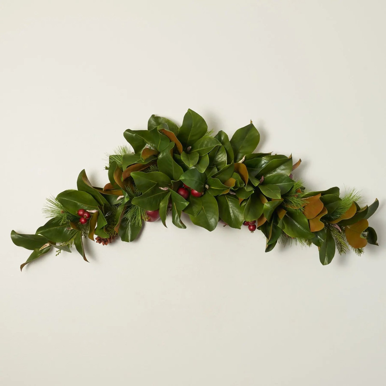 FDS1102ChristmasFoliagewithFauxRedApple_WinterPineconeClassicHolidayMagnoliaSwag_2 Real Touch Magnolia Leaf, Scotch Pine, & Faux Red Apple Classic Holiday Doorway Arched Swag - Image 1