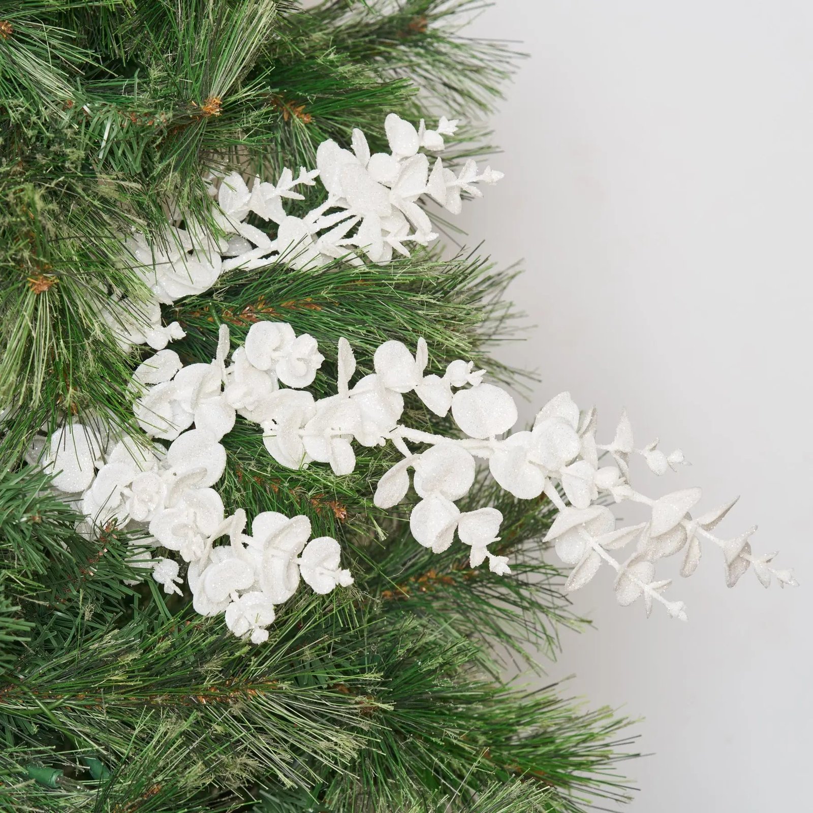 FLWSTM1282WhiteGlitterEucalyptusFestiveWinterSpray White Glitter Snow Eucalyptus Faux Winter Stem Spray - 24 - Image 1