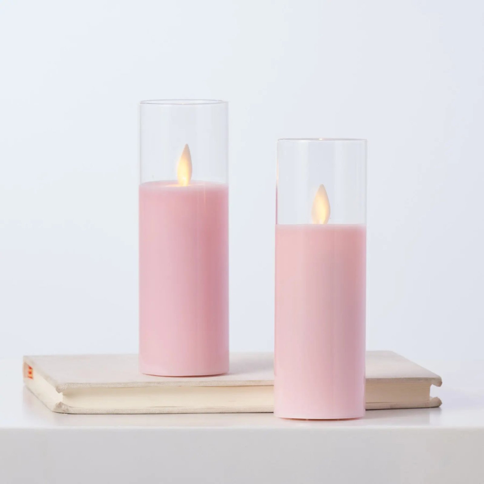 HMD1523MovingFlamelessLEDPinkGlassPillarCandleswithRemoteSetof2_1 Moving Flameless LED Pink Glass Pillar Candles with Remote Set of 2 - Image 1
